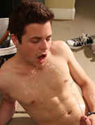 Hot smooth twink Dustin Fitch lays down in the garage, soaks his clothes an